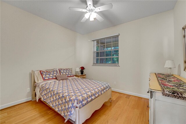 bedroom featuring ceiling fan and light hardwood / wood-style flooring