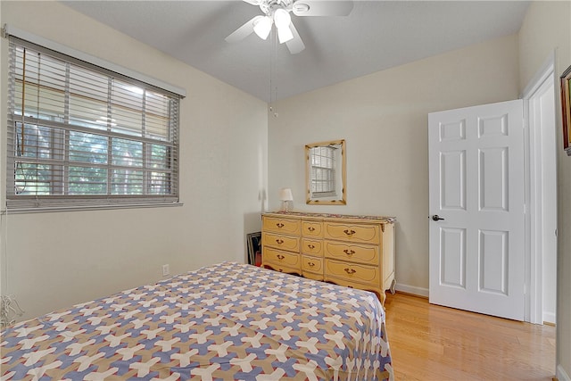 bedroom with light wood-type flooring and ceiling fan