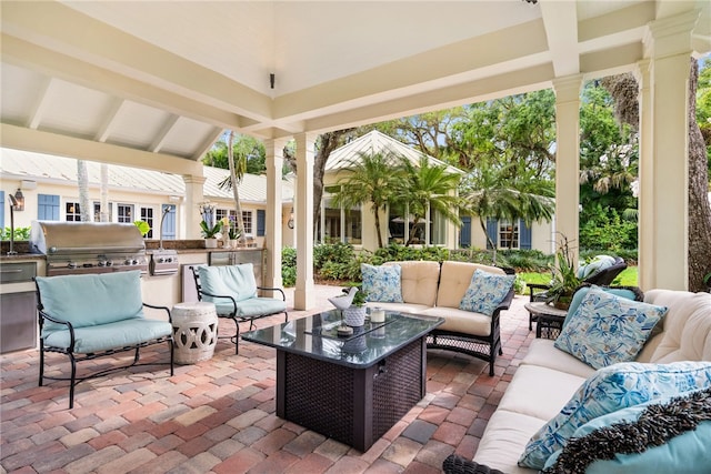 sunroom featuring plenty of natural light and lofted ceiling with beams