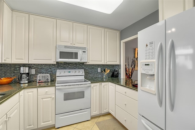 kitchen featuring white cabinetry, white appliances, and light tile patterned floors