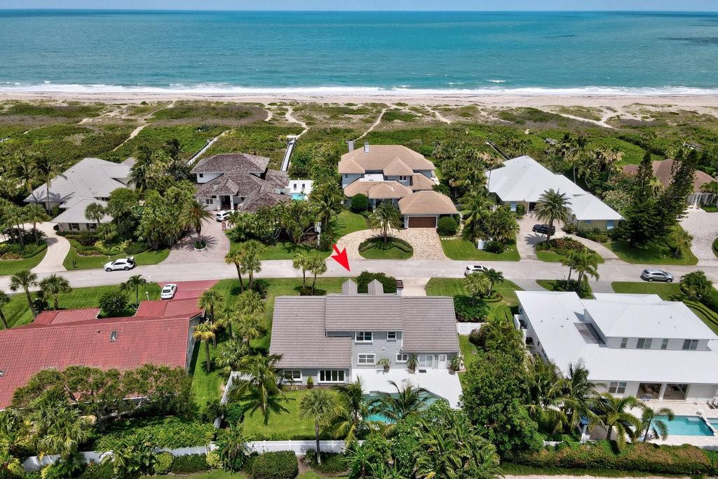 bird's eye view featuring a beach view and a water view