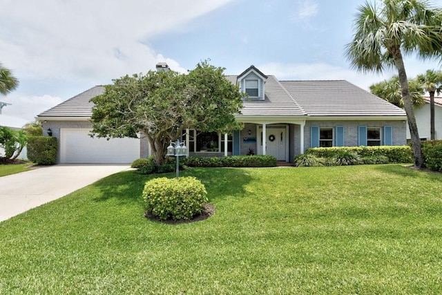 view of front of property featuring a garage and a front lawn