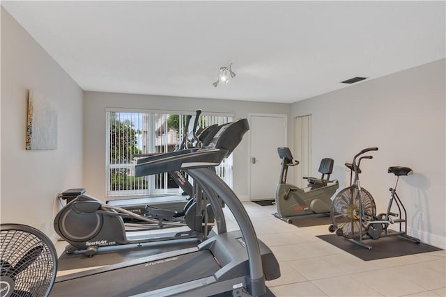 exercise area with light tile patterned flooring