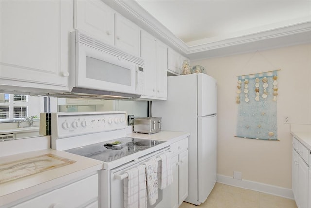 kitchen featuring white cabinets, light tile patterned floors, white appliances, and crown molding