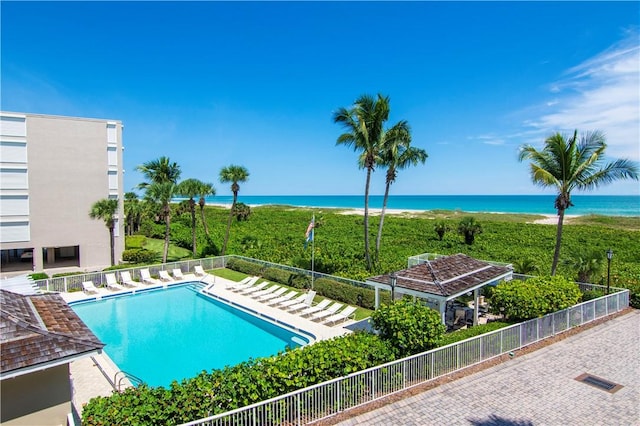 view of swimming pool with a gazebo and a water view