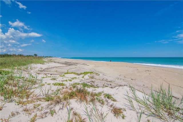 property view of water featuring a beach view