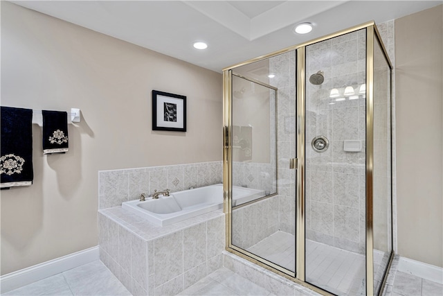 bathroom with shower with separate bathtub and tile patterned floors