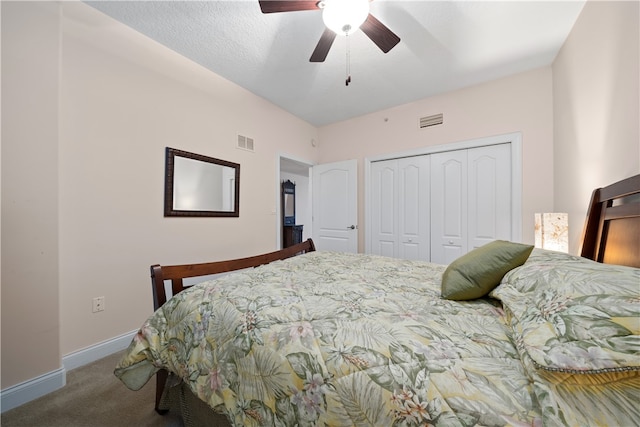 carpeted bedroom with ceiling fan and a closet