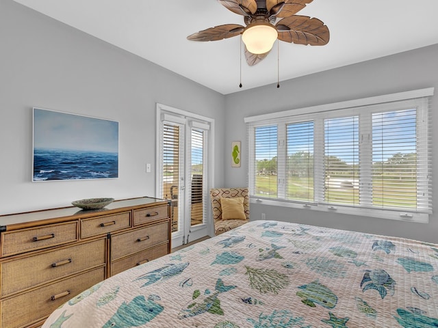 bedroom with access to exterior, wood-type flooring, and ceiling fan