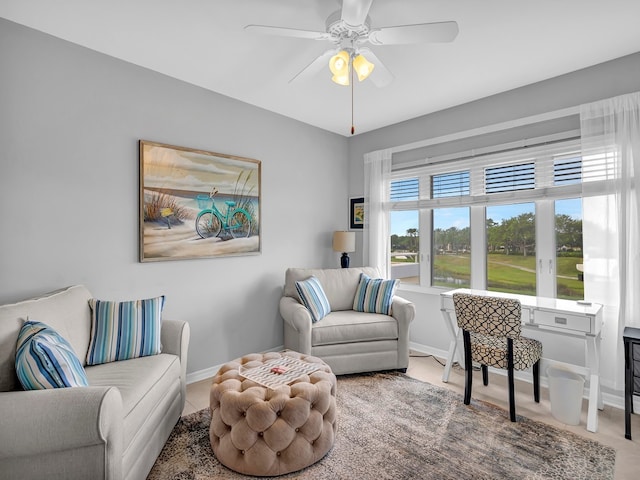 living area with ceiling fan