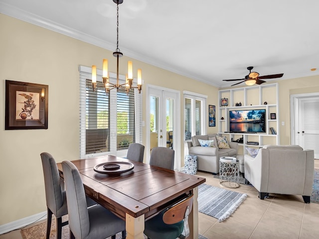 tiled dining room featuring ceiling fan with notable chandelier and crown molding