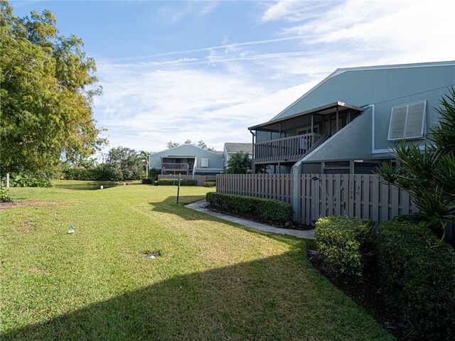 view of yard featuring a sunroom