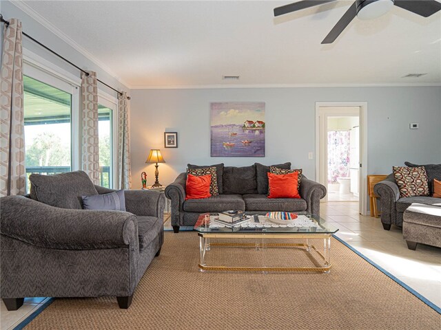 tiled living room featuring ceiling fan and crown molding