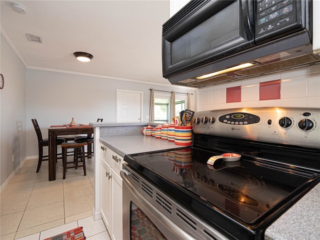 kitchen with white cabinets, decorative backsplash, stainless steel range with electric stovetop, light tile patterned flooring, and crown molding