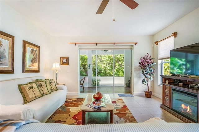 tiled living room featuring ceiling fan