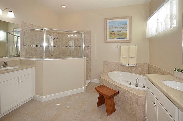 bathroom featuring tile patterned floors, vanity, and plus walk in shower