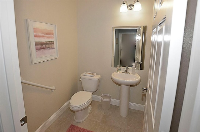 bathroom featuring tile patterned flooring and toilet