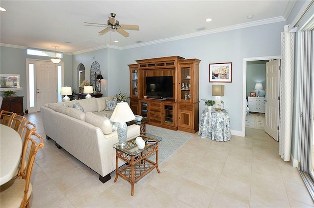 tiled living room featuring ceiling fan and crown molding