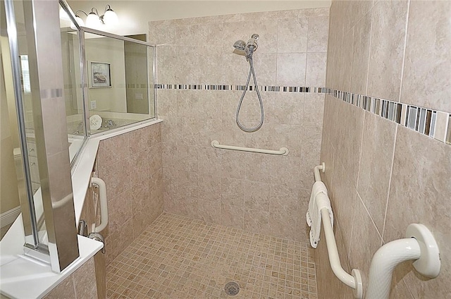 bathroom with a tile shower