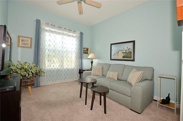 living room with ceiling fan and carpet floors