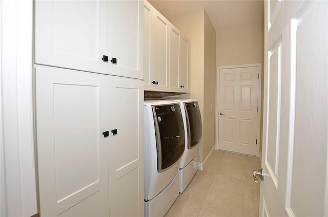 laundry area with cabinets and separate washer and dryer