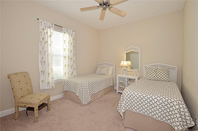 bedroom featuring ceiling fan and light colored carpet