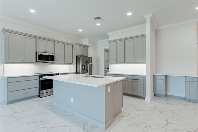 kitchen featuring marble finish floor, a center island with sink, light countertops, visible vents, and appliances with stainless steel finishes