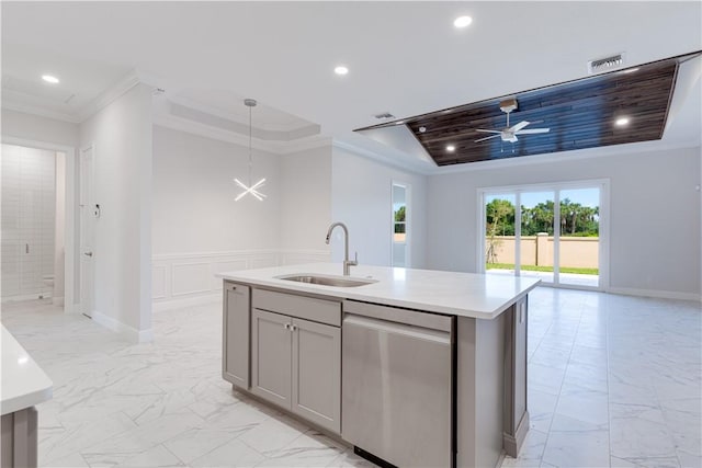 kitchen with open floor plan, a sink, marble finish floor, light countertops, and stainless steel dishwasher