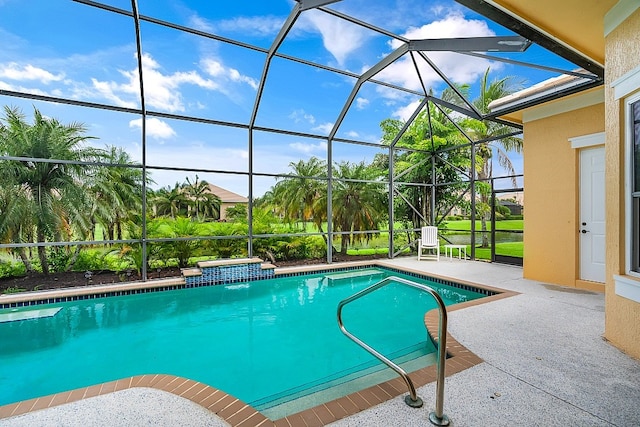 pool featuring glass enclosure and a patio