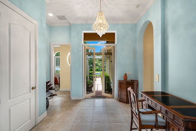 doorway to outside with light tile patterned flooring, a chandelier, and crown molding