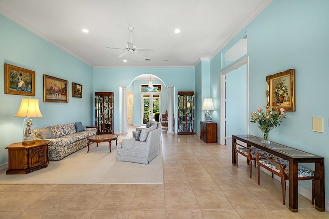 tiled living room featuring ceiling fan and crown molding