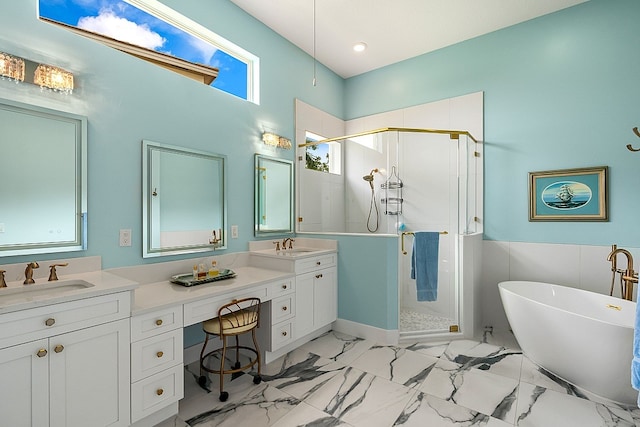 full bath featuring a sink, a freestanding bath, double vanity, and a shower stall