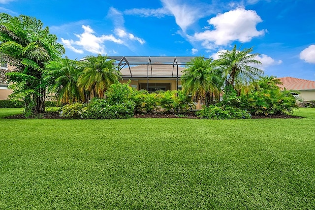 view of yard featuring glass enclosure