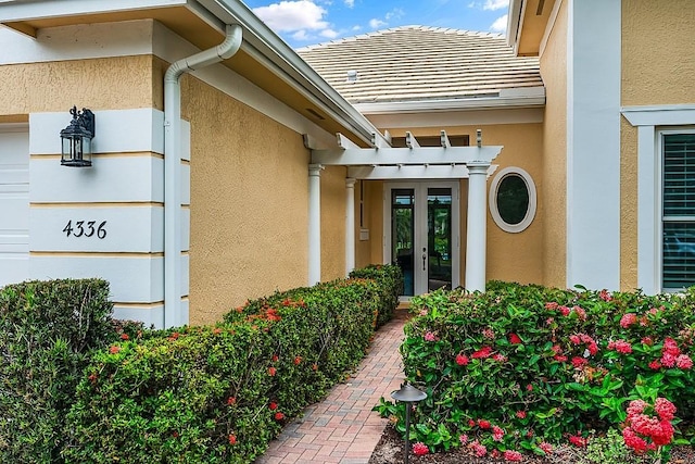 4336 Summer Breeze Ter, Vero Beach, FL 32967 - entrance to property with stucco siding and french doors