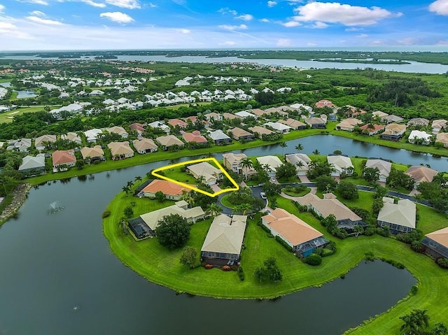 bird's eye view featuring a residential view and a water view