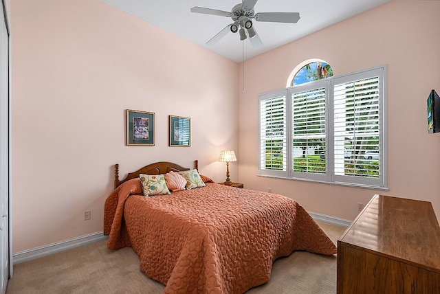 carpeted bedroom featuring ceiling fan