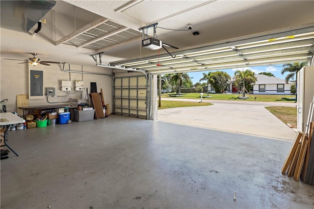 6029 Winfield Dr, Port St Lucie, FL 34986 - garage featuring a garage door opener and electric panel