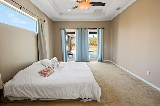 6029 Winfield Dr, Port St Lucie, FL 34986 - bedroom with carpet flooring, crown molding, a raised ceiling, access to exterior, and visible vents