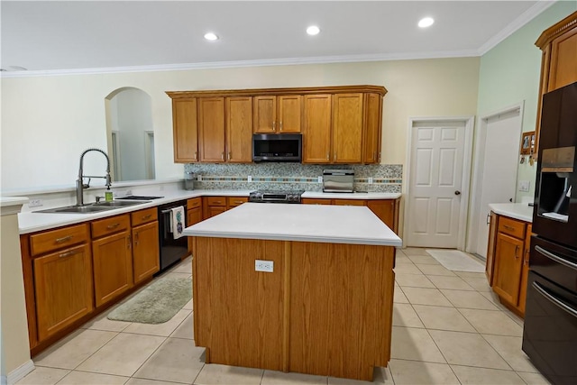 6029 Winfield Dr, Port St Lucie, FL 34986 - kitchen with a sink, brown cabinetry, and black appliances