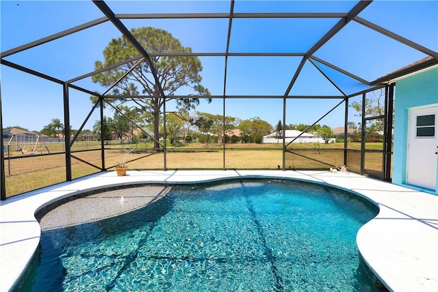 6029 Winfield Dr, Port St Lucie, FL 34986 - outdoor pool with glass enclosure, a patio area, and a yard