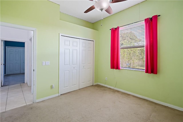 6029 Winfield Dr, Port St Lucie, FL 34986 - unfurnished bedroom featuring baseboards, carpet flooring, ceiling fan, and a closet