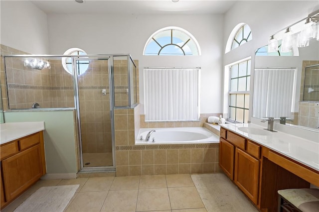 6029 Winfield Dr, Port St Lucie, FL 34986 - bathroom with vanity, tile patterned floors, a shower stall, and a garden tub