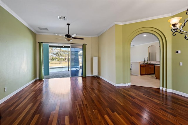 6029 Winfield Dr, Port St Lucie, FL 34986 - unfurnished room featuring visible vents, arched walkways, and hardwood / wood-style flooring