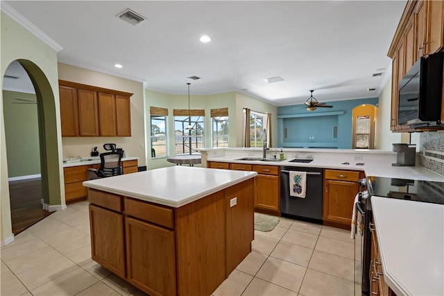 6029 Winfield Dr, Port St Lucie, FL 34986 - kitchen featuring a sink, a healthy amount of sunlight, a kitchen island, visible vents, and black appliances