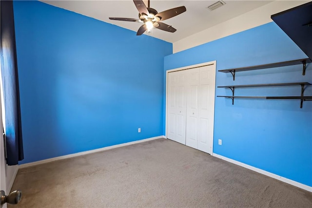 6029 Winfield Dr, Port St Lucie, FL 34986 - unfurnished bedroom with carpet floors, a ceiling fan, baseboards, visible vents, and a closet