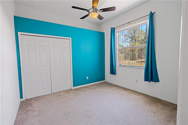 6029 Winfield Dr, Port St Lucie, FL 34986 - unfurnished bedroom featuring a ceiling fan, baseboards, carpet, and a closet