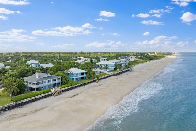 bird's eye view featuring a view of the beach and a water view