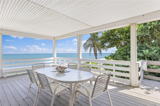 wooden terrace with a beach view and a water view