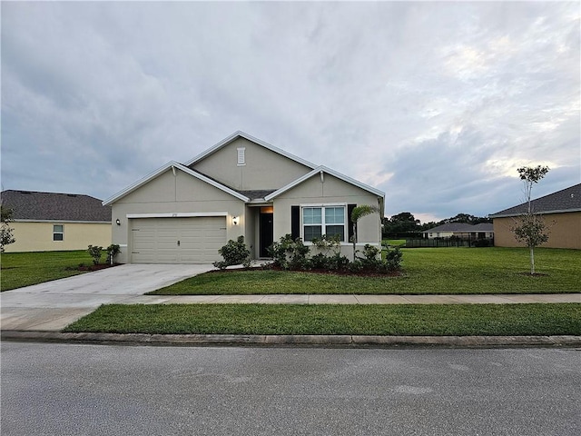 2735 Hanover St SW, Vero Beach, FL 32968 - view of front of home with driveway, a front yard, an attached garage, and stucco siding
