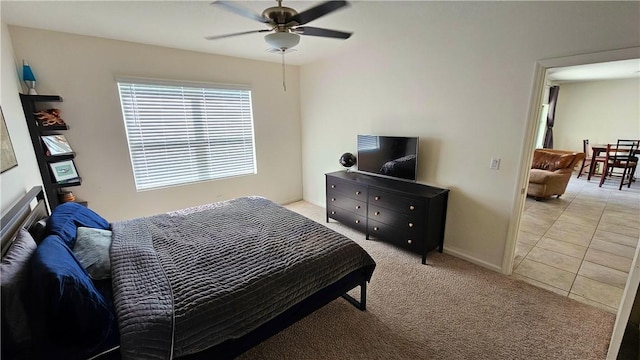 2735 Hanover St SW, Vero Beach, FL 32968 - bedroom featuring light carpet, baseboards, a ceiling fan, and light tile patterned floors